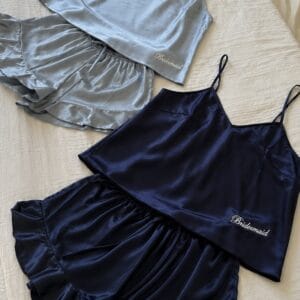Elegant satin bridal party pajamas in grey and navy for wedding mornings.