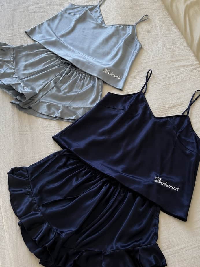 Elegant satin bridal party pajamas in grey and navy for wedding mornings.