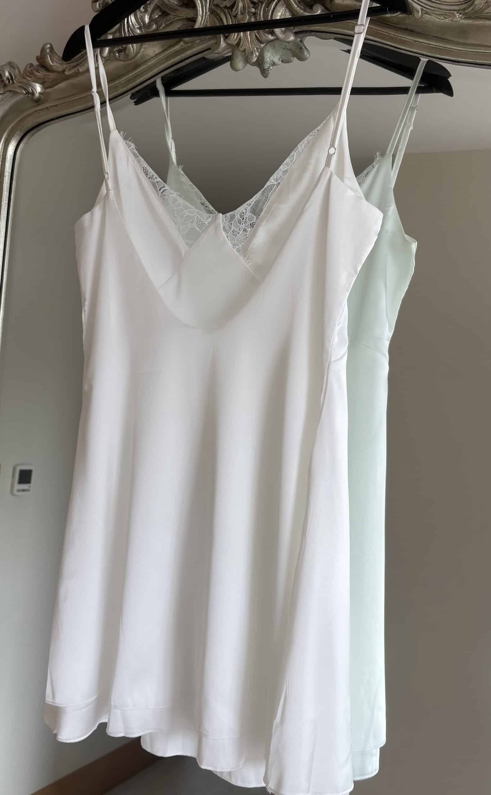 Elegant white satin slip with lace details for bridal wear.
